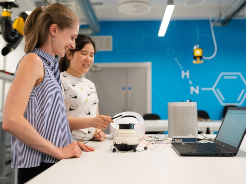 Two female students in an engineering lab