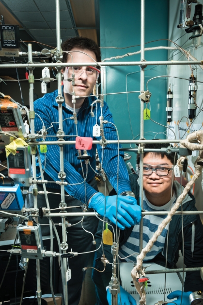 Chemical engineering professor working with student in lab